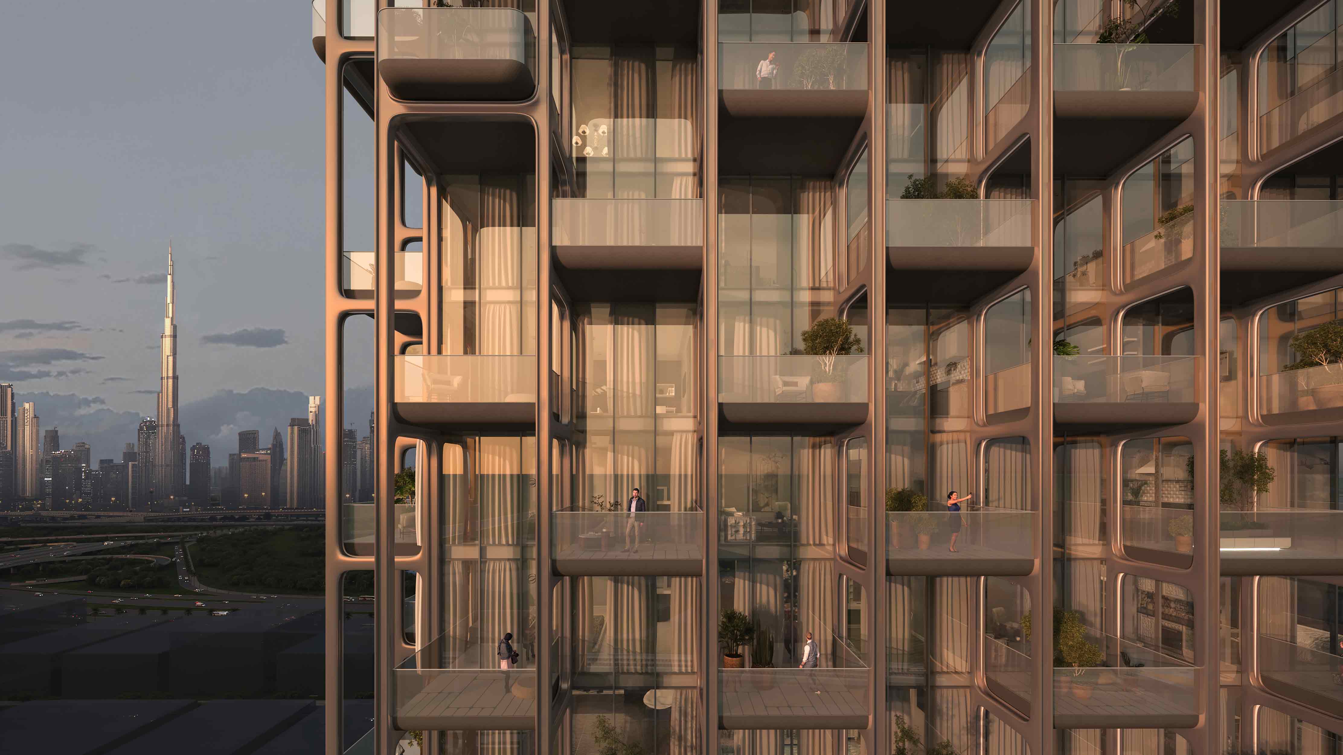 The Symphony By Imtiaz A modern residential building featuring glass balconies, with people and greenery, against a city skyline at sunset.